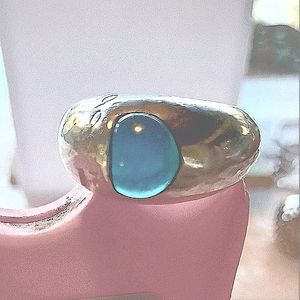 Sterling silver dome ring with a marble like turquoise stone.